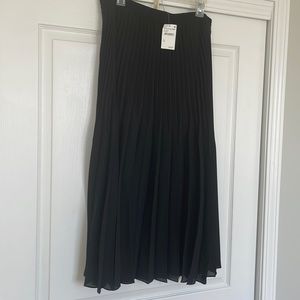 Max studio, black, pleated midi skirt. A great basic for the holidays.